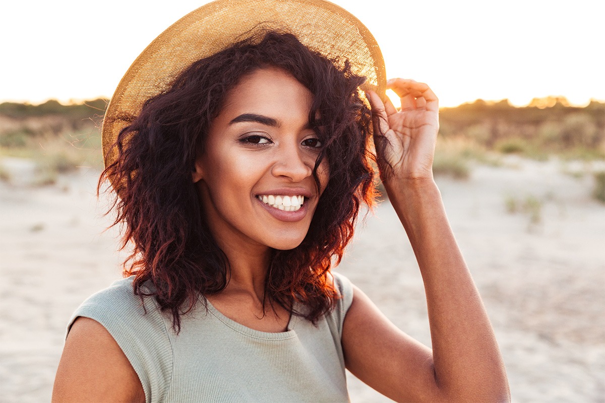 woman in hat smiling