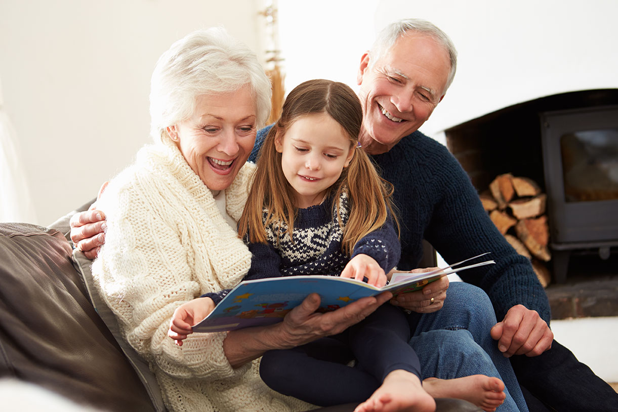 Grandparents Reading to Grandchild