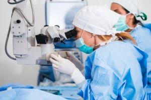 eye surgeon performing eye surgery on a patient